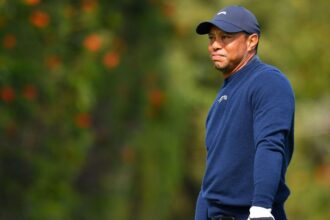 Tiger chipping, putting, says recovery from disc surgery is 'slow'