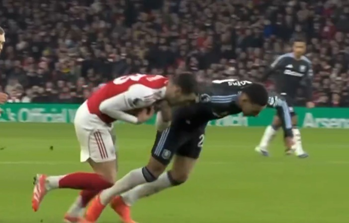 Arsenal midfielder Mikel Merino stirs controversy by avoiding second yellow card for dragging down Aston Villa's Morgan Rodgers (video)