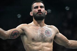 Benoit Saint-Denis celebrates after defeating Mauricio Ruffy at UFC Paris