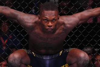 Israel Adesanya stares down his opponent in the Octagon at UFC Saudi Arabia