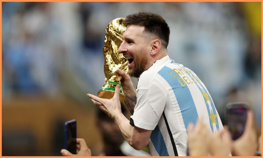 Lionel Messi celebrating with the World Cup trophy