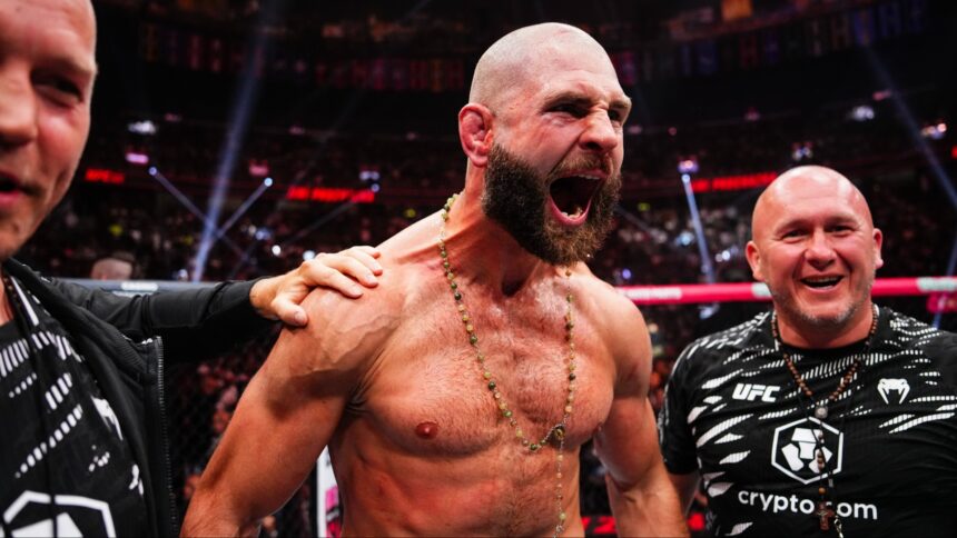 Jiri Prochazka celebrates his win with his team at UFC 320