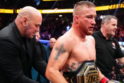 Justin Gaethje gets a UFC belt wrapped around his waist by Dana White at UFC 324