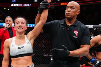 Maycee Barber gets her hand raised after her fight at UFC 323