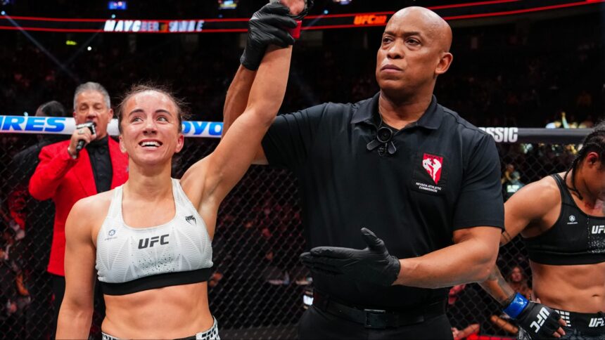 Maycee Barber gets her hand raised after her fight at UFC 323