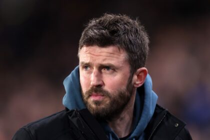 Michael Carrick looks on