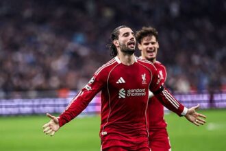 Dominik Szoboszlai celebrates his freekick for Liverpool