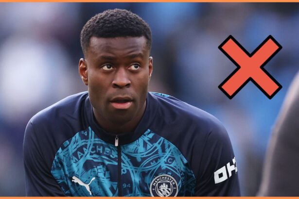 Marc Guehi warming up for Manchester City