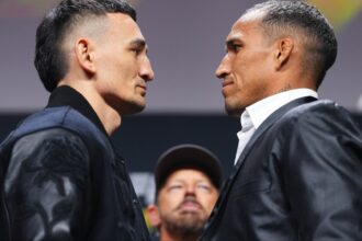 Max Holloway and Charles Oliveira face off at a press conference