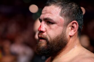 Tai Tuivasa departs the Octagon after a loss at UFC 325