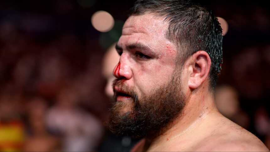 Tai Tuivasa departs the Octagon after a loss at UFC 325
