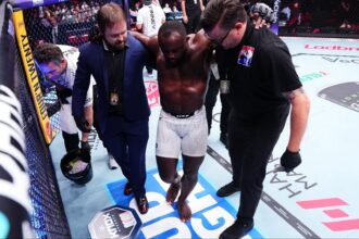 Torrez Finney is helped to his corner at UFC 325