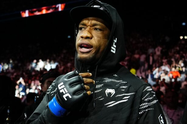 Jailton Almeida walks to the Octagon for his fight at UFC 321