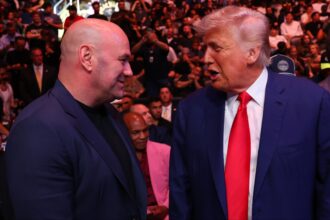 Dana White and Donald Trump speaking cageside at UFC 316