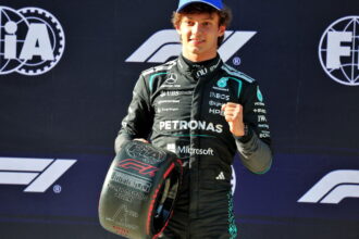 Antonelli celebrates after becoming F1's youngest pole-sitter in China