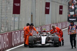 Gabriel Bortoleto is pushed back into the pit lane