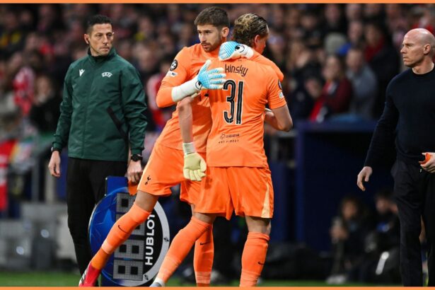 Guglielmo Vicario of Tottenham Hotspur embraces his teammate Antonin Kinsky