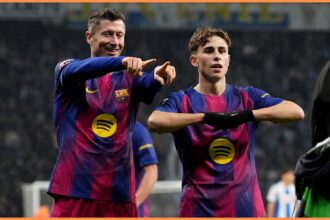 Robert Lewandowski celebrates a goal for Barcelona