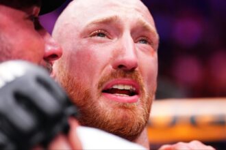 Joe Pyfer embraces his coach following a win at UFC Seattle