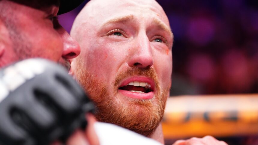Joe Pyfer embraces his coach following a win at UFC Seattle