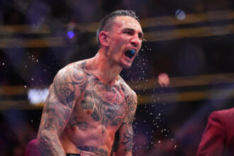 Max Holloway celebrates UFC win