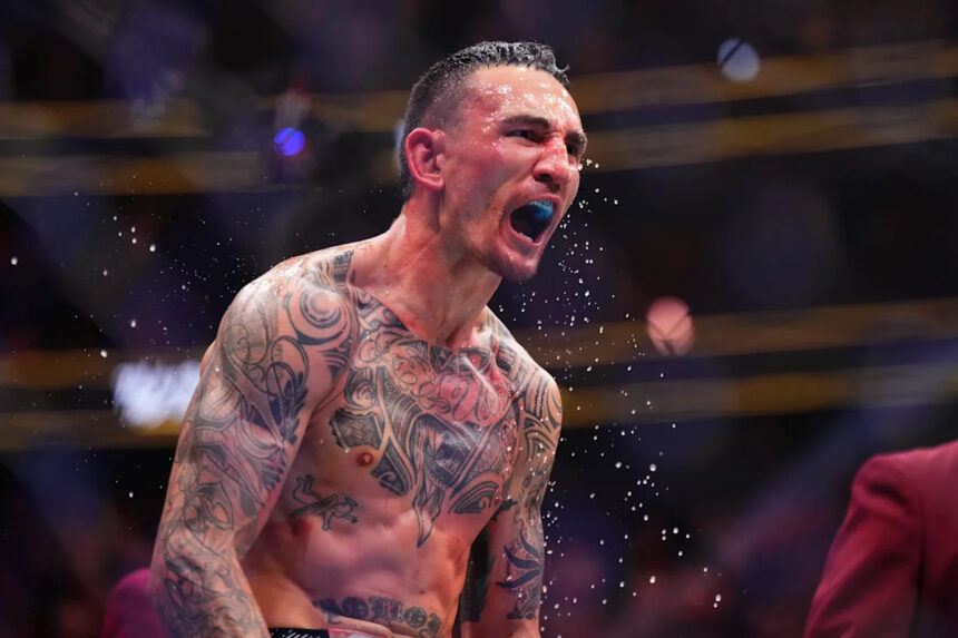 Max Holloway celebrates UFC win