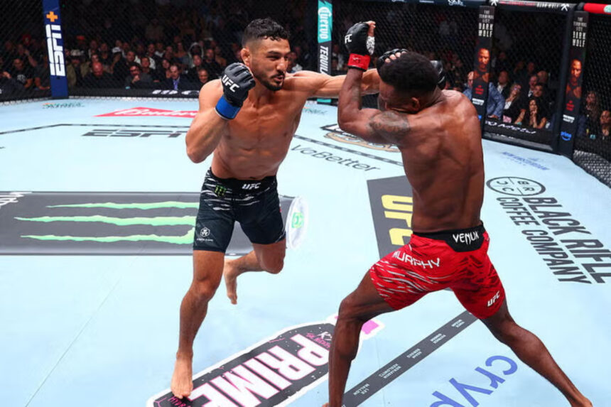 Aaron Pico throws a punch at Lerone Murphy during UFC 319