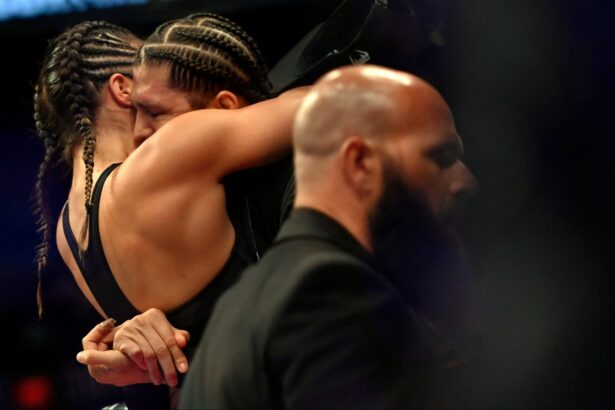 Tracy Cortez and Brian Ortega embrace at UFC 274