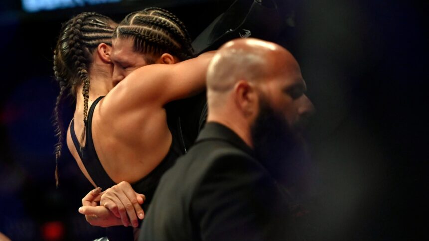 Tracy Cortez and Brian Ortega embrace at UFC 274
