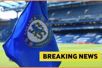 Chelsea FC logo on corner flag, and breaking news banner