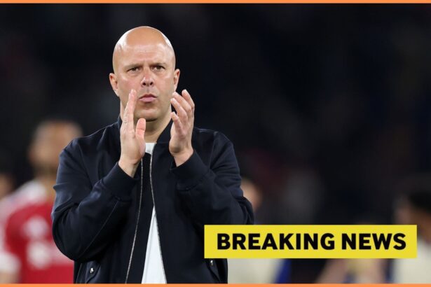 Arne Slot applauds the Liverpool fans, and