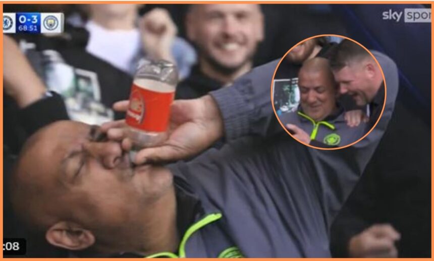 Manchester City fan with Arsenal branded bottle