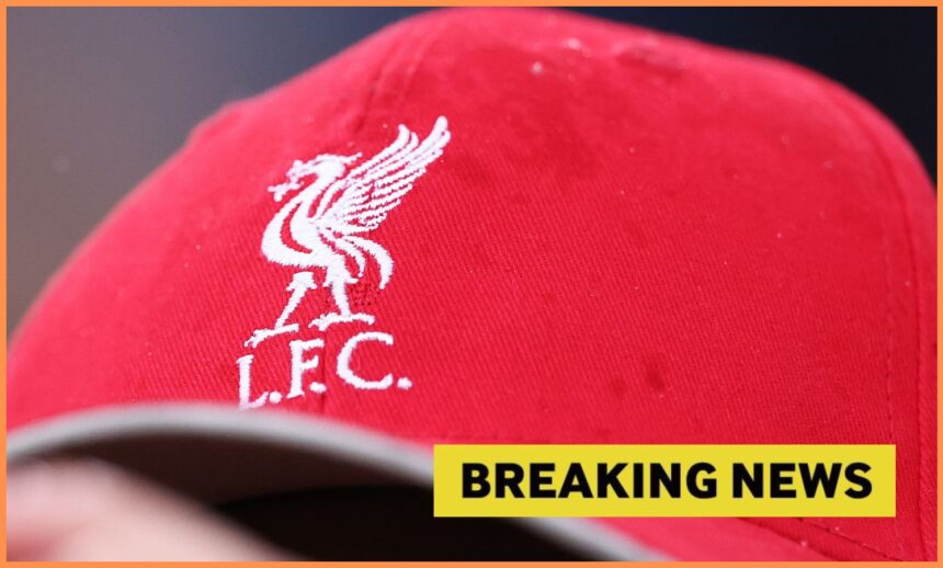 Liverpool logo on hat, and breaking news banner