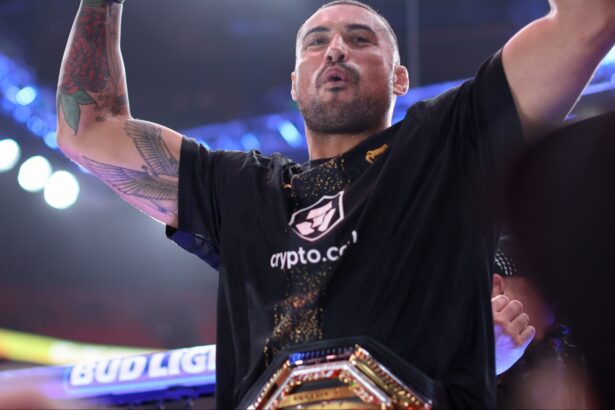 Carlos Ulberg celebrates after winning at UFC 327