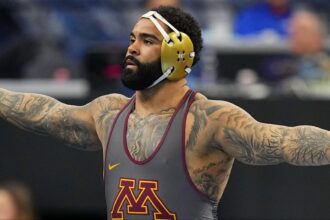 Gable Steveson celebrates a win at the NCAA Championships