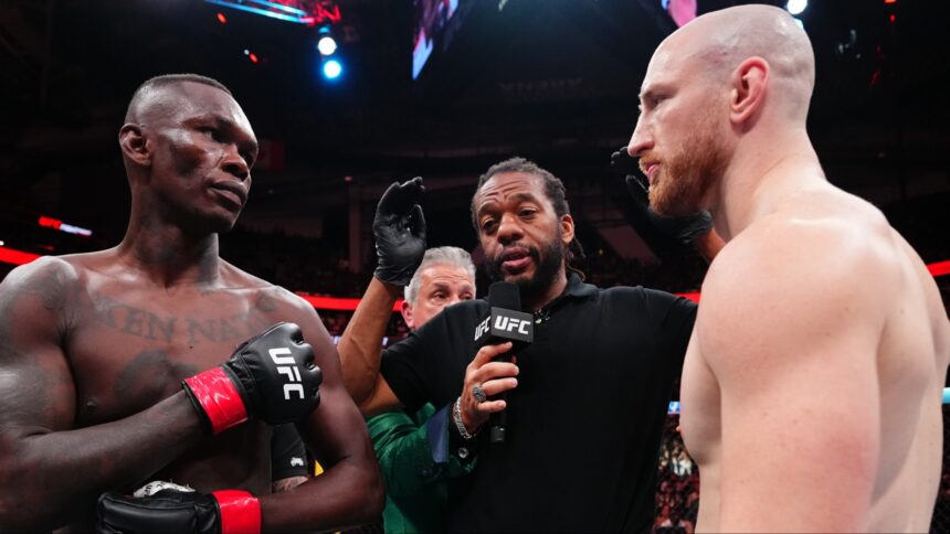 Israel Adesanya and Joe Pyfer face off