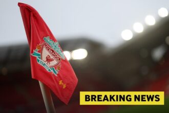 A Liverpool FC corner flag at Anfield, plus a