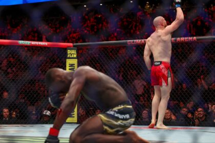 Israel Adesanya reacts as Joe Pyfer celebrates at UFC Seattle