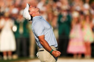 Rory McIlroy receives congratulations after winning second consecutive Masters