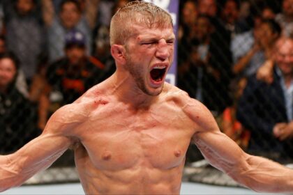 TJ Dillashaw celebrates after defeating Renan Barao for the UFC bantamweight title