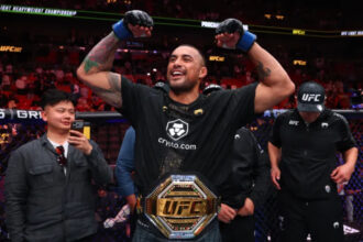 Carlos Ulberg celebrates UFC 327 title win