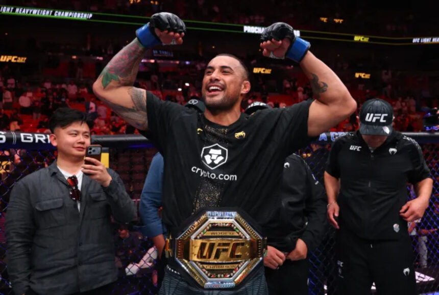 Carlos Ulberg celebrates UFC 327 title win